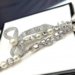 Комплект Chanel с бантиком (колье, серьги)