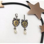 Серьги Alexander McQueen с черепом